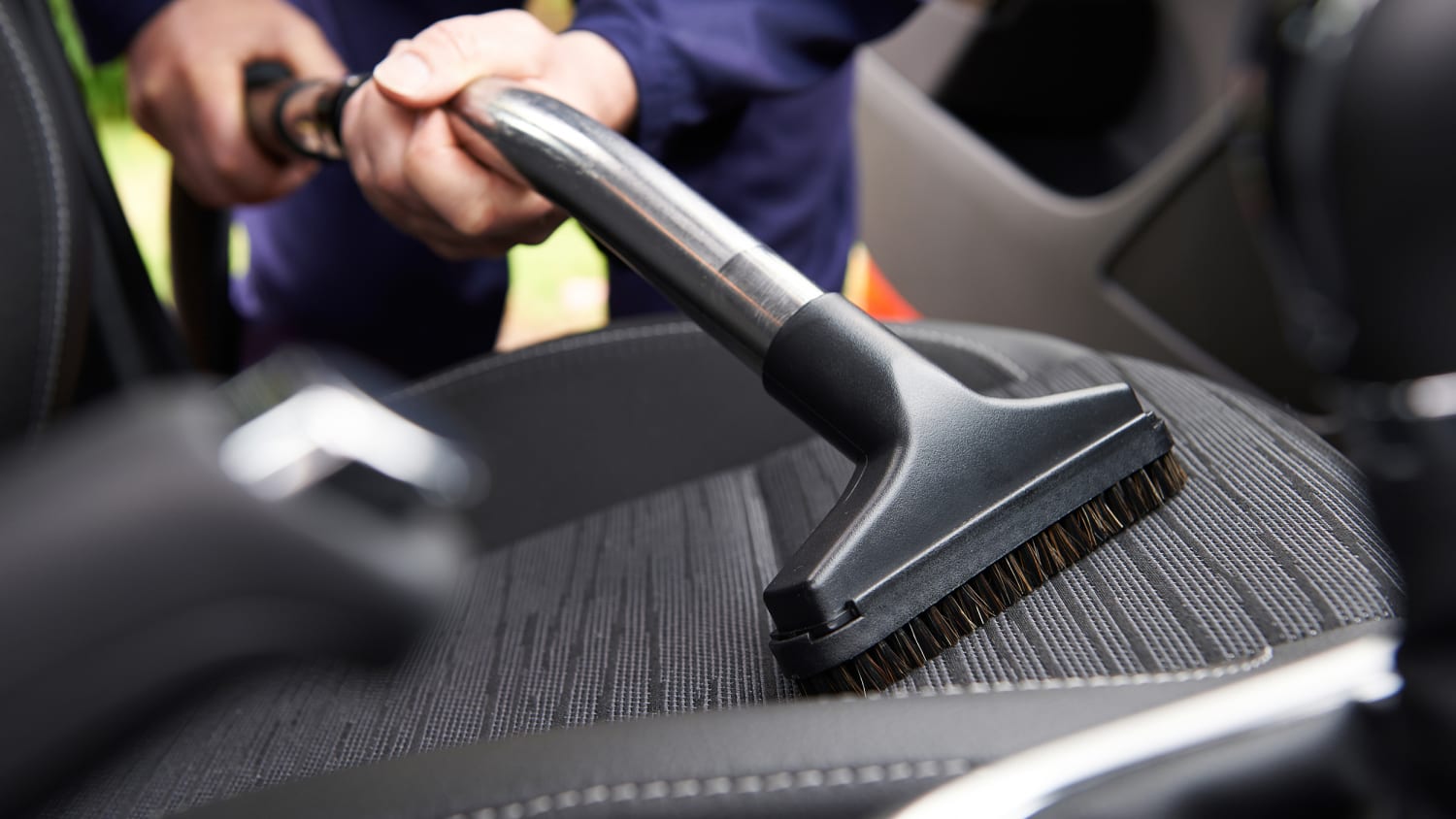 Interior car deep clean — professional vacuuming car seat